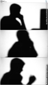 男人电脑前办公接电话剪影