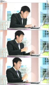 商务男士打字看电脑握拳欢呼