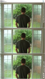 男人看窗外风雨