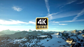 航拍雪山顶上的云彩