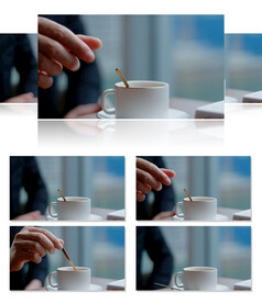 商务窗边搅拌咖啡杯书籍休闲室内