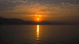 大海海边清晨日出风光4K航拍视